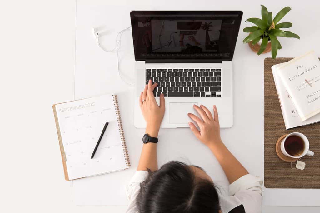 Aftercare services with a picture of planning on laptop at Malta Rehab